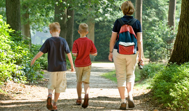 Family walking on nature trail